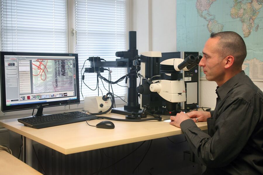 Fig. 1: For Martin Fischer, expert appraiser of documents in Stuttgart, Germany, the stereo microscope with LED illumination and digital camera is an indispensable tool for examining the authenticity of suspicious ID cards, visas, and other kinds of documents