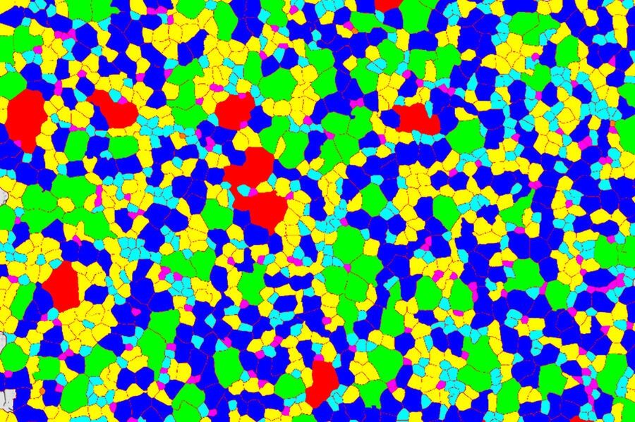 Immagine di una lega di acciaio con grani codificati per colore in base alle dimensioni.