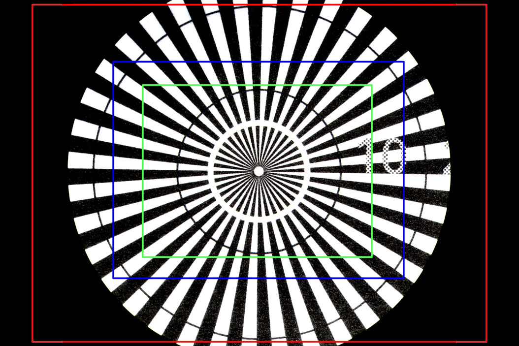 Image of a Siemens star, where the diameter of the 1st black line circle is 10 mm and the 2nd is 20 mm, taken via an eyepiece of a M205 A stereo microscope. The rectangles represent the field of view (FOV) of a Leica digital camera when installed with various C-mounts (red 0.32x, blue 0.5x, green 0.63x). 30_000-to1-magnification.jpg