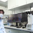 The head of Charité’s Institute of Virology on Campus Charité Mitte, Prof. Dr. Christian Drosten, at the laboratory workplace with the THUNDER Imager 3D Live Cell from Leica Microsystems.