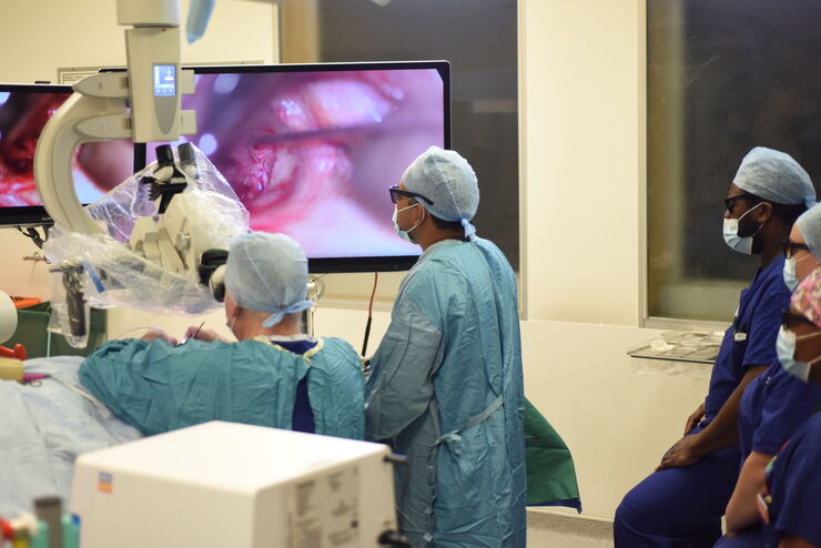 John Hamilton, Bchir, MB, FRCS, Consultant Ear, Nose & Throat Surgeon, Gloucester Royal Hospital. Dr. Hamilton during ontological surgery with his trainees. 