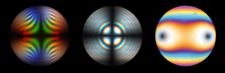 Conoscopic image of Brookit, TiO2, with strong dispersion colors Uni-axial interference figure of thick calcite plate, perpendicular to optical axis
Bi-axial interference figure of thin biotite crystal in diagonal position at circular polarized light. Position of optical axis can be clearly identified