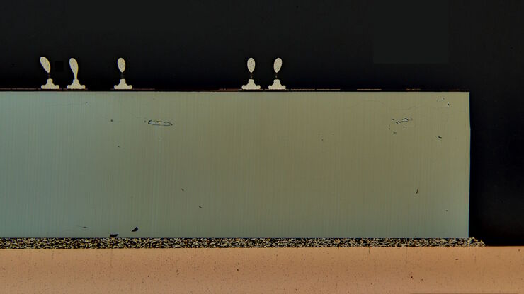 Image of an integrated-circuit (IC) chip cross section acquired at higher magnification showing a region of interest. Image of an integrated-circuit (IC) chip cross section acquired at higher magnification showing a region of interest.