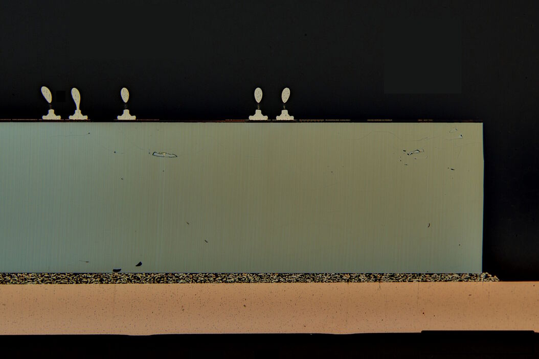 [Translate to chinese:] Image of an integrated-circuit (IC) chip cross section acquired at higher magnification showing a region of interest. IC_chip_cross_section.jpg