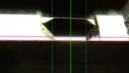 [Translate to chinese:] Camera image during auto alignment. The feedback lines indicate if the correct edges in the image are detected. Green: Vertical center line; Magenta: Upper edge of the light gap; White: Lower edge of the light gap (not visible here, falling together with red line); Red: Knife edge; Blue: Left and right edge of the block face being automatically detected.