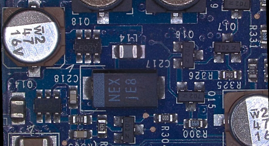 Low magnification DVM6 image of a part of the PCBA sample.