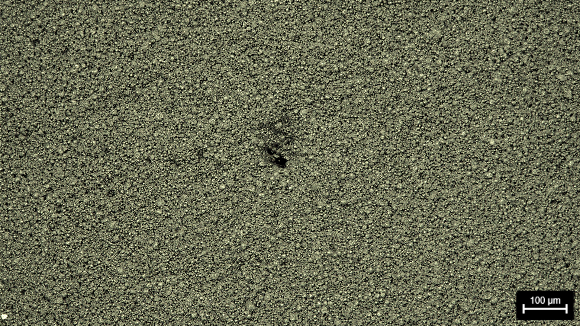 Elettrodo della batteria che mostra un difetto nel foro. Immagine acquisita con illuminazione in campo scuro e microscopio composto Leica.